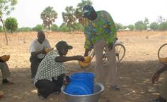 Distributing safe drinking water in an African village striken by Cholera